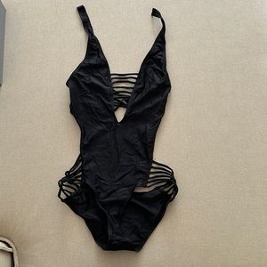 Black strappy one piece bathing suit
